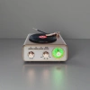 Retro black and gold color audio equipment with a green tuning knob for the turntable Specification image